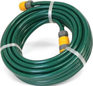 Green high pressure garden hose packed in a coil