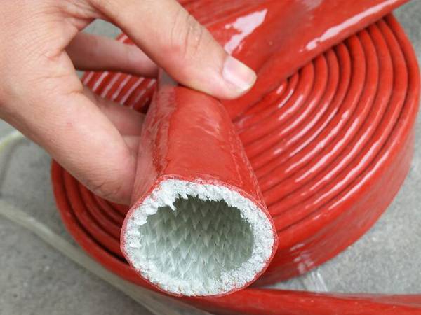 A roll of red hose sleeve of high temperature resistant flexible metal hose