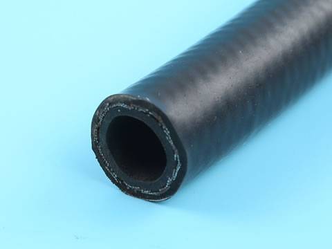 The cross section of SAE 100 R1 steel wire reinforced hydraulic hose.
