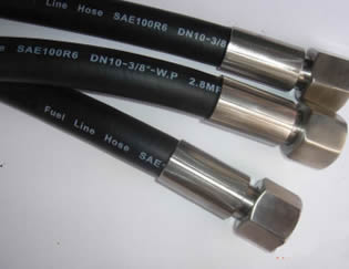 Several SAE 100 R6 textile reinforced hydraulic hose assemblies are on the floor.