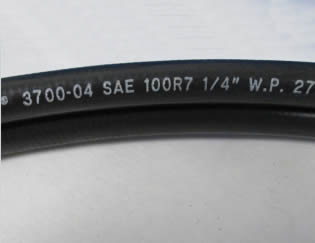 A section of SAE 100 R7 thermoplastic hydraulic hose.