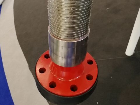 An armoured choke and kill hose is placed on the ground.
