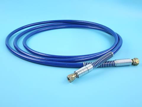 A roll of steel wire reinforced nylon resin hose with brass assembly.